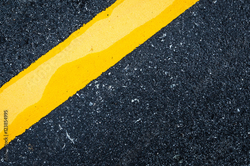 Asphalt road background with traffic line-close up © chayantorn
