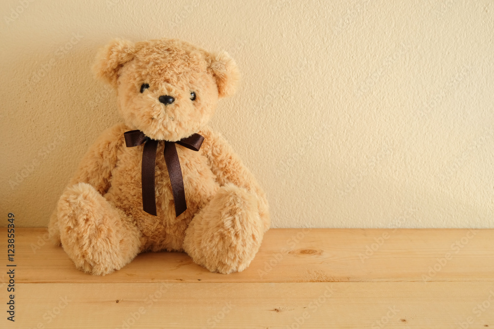 Teddy Bear toy alone on wooden table Teddy Bear toy alone on wooden table