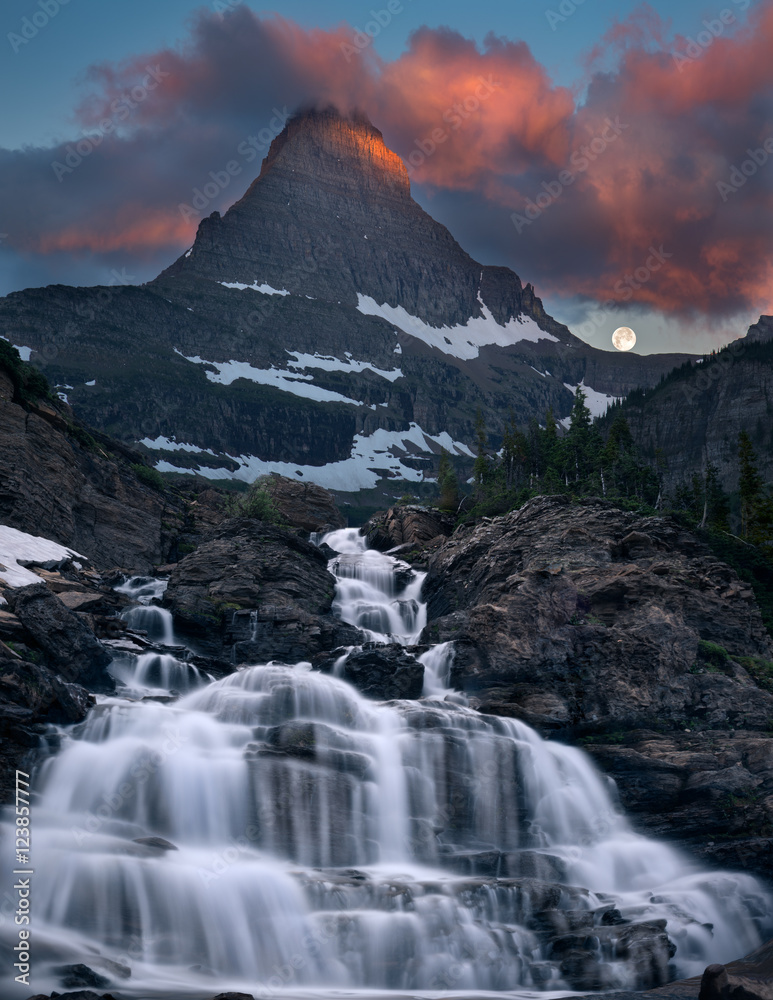 Glacier Morning waterfall and moonset Glacier Morning waterfall and moonset