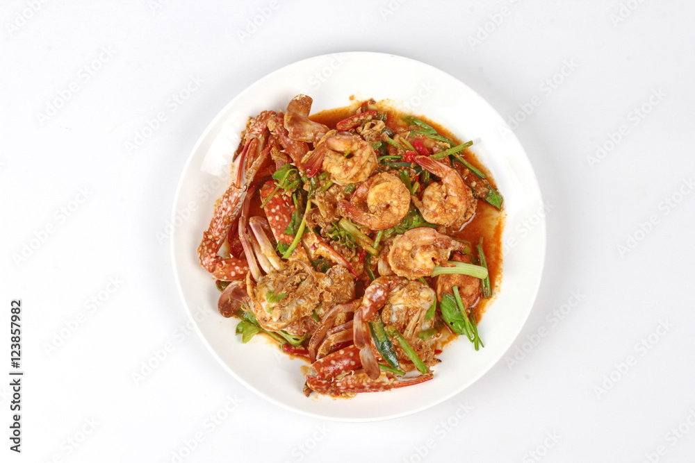 Stir-fried crab and shrimp in curry power is top-ten of popular Thai food as seafood to fried with  fresh milk ,grill curry ,egg ,oyster oil and yellow curry power. 