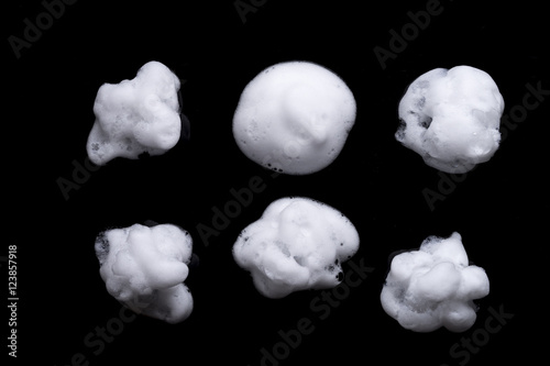 Shave foam or cream isolated on black background photo