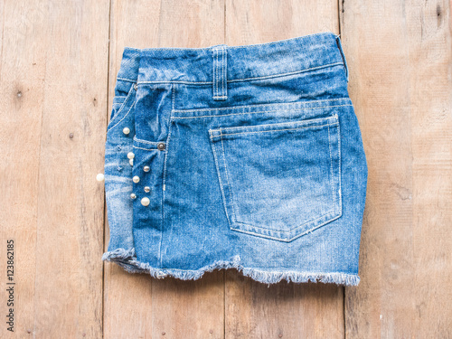 Short jean on wood background
