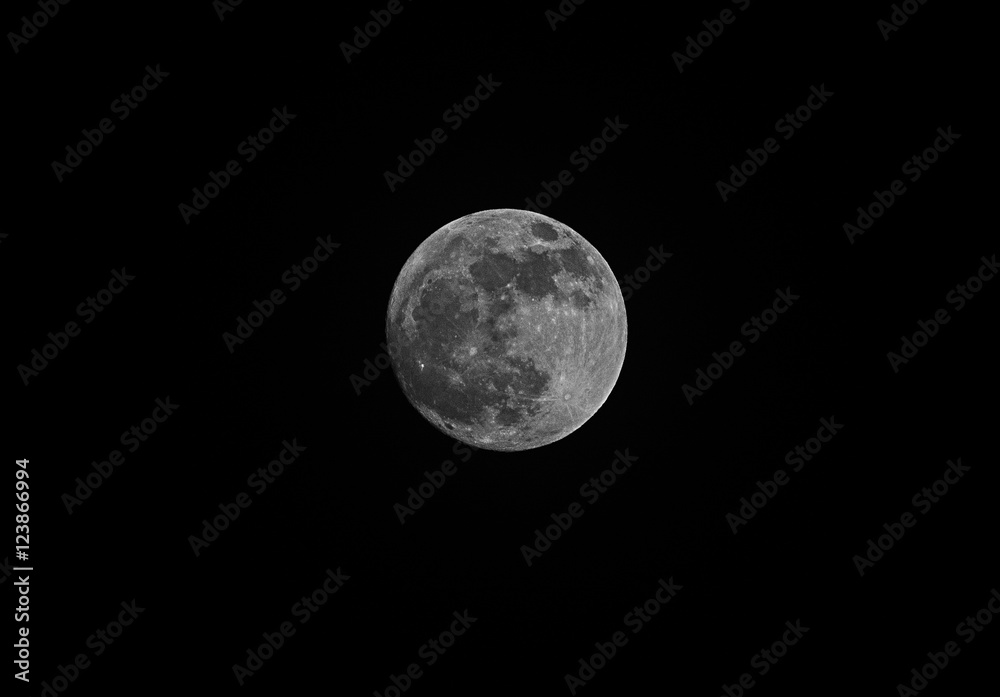 full moon over dark black sky at night full moon over dark black sky at night