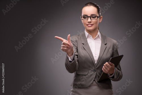 Young businesswoman pressing virtual button