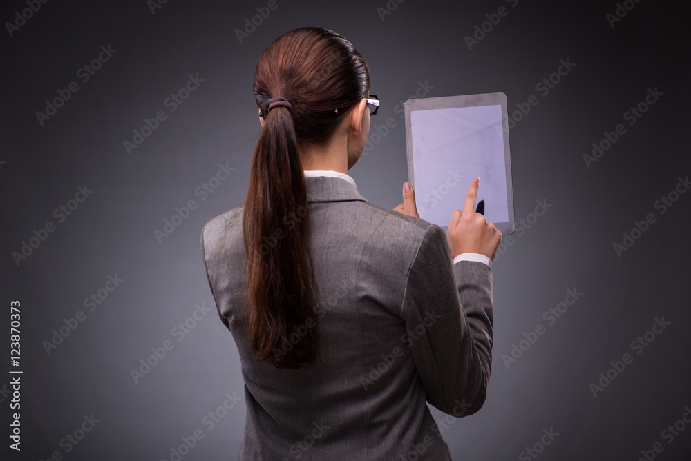 Naklejka premium Woman with tablet computer in business concept