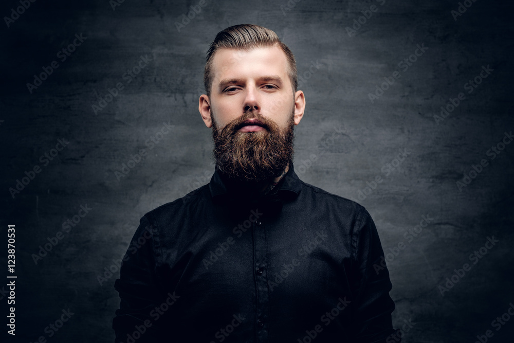Studio portrait of bearded hipster male.