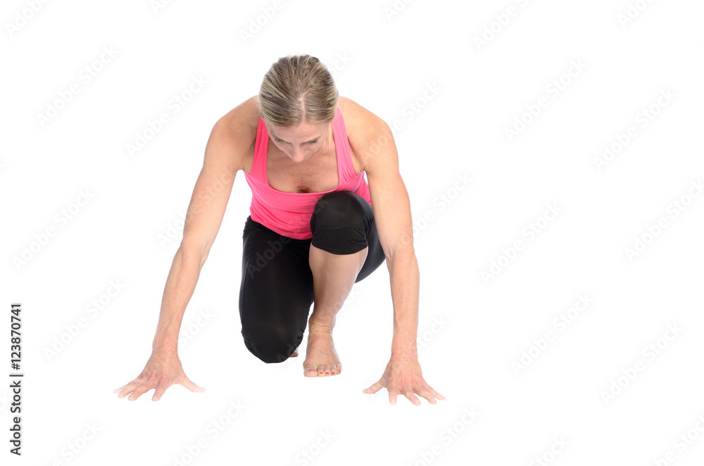 Fit determined woman in the starter position Fit determined woman in the starter position