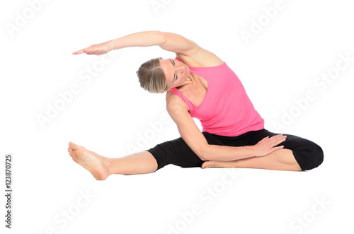 Barefoot fit young woman doing yoga