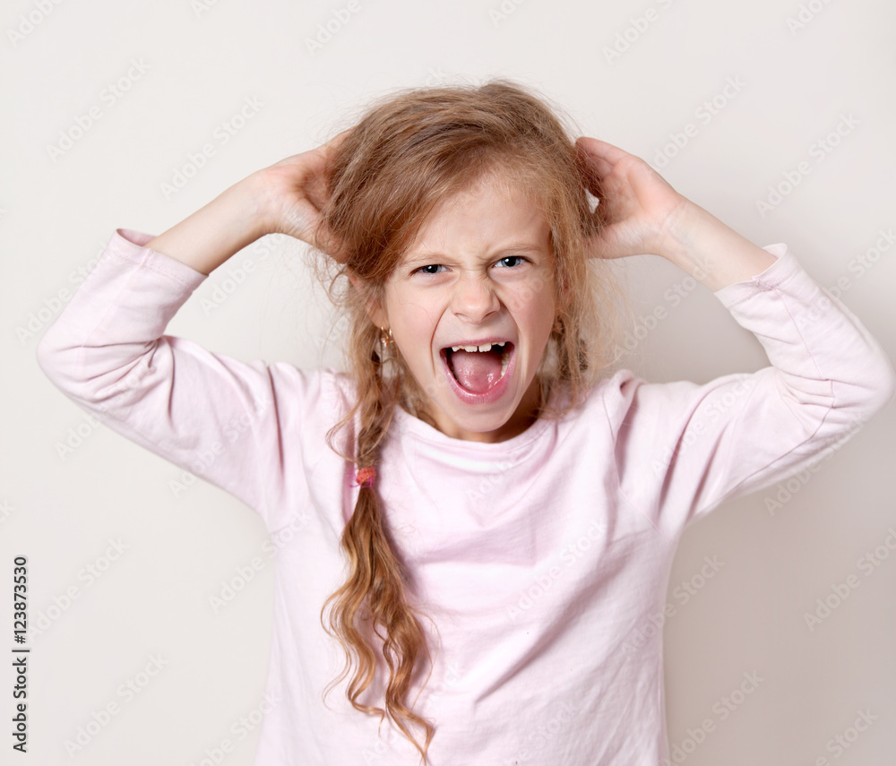the little girl cries and screams,ears ,hands the little girl cries and screams,ears ,hands