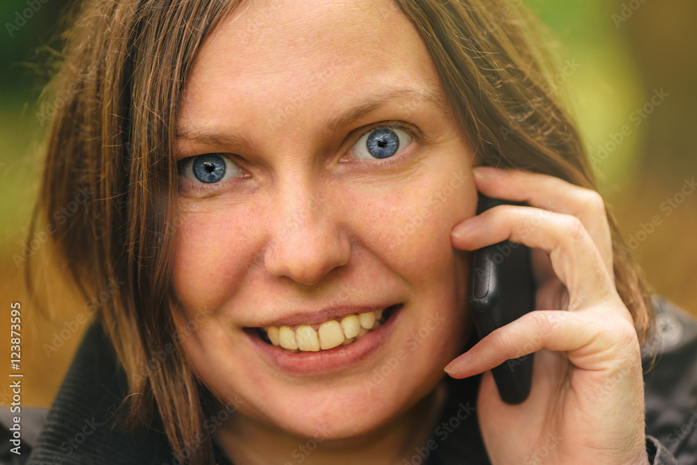 Close up face portrait of beautiful woman talking on phone Close up face portrait of beautiful woman talking on phone