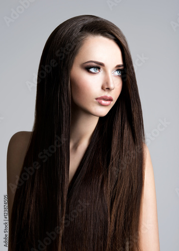 Portrait of beautiful woman with long straight brown hair