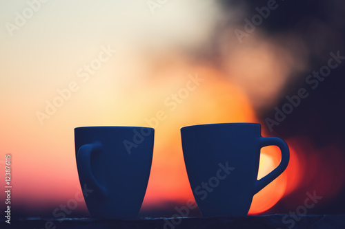 Coffee in sunset / sunrise. Shallow depth of field.