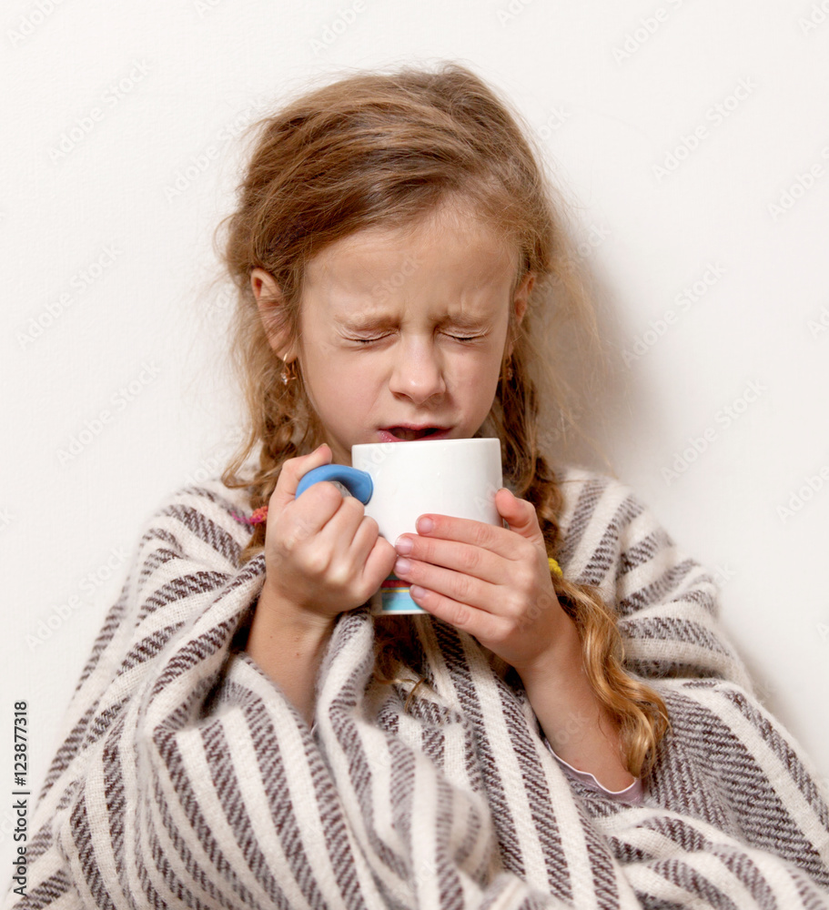a little girl with a mug, temperature , illness, blanket