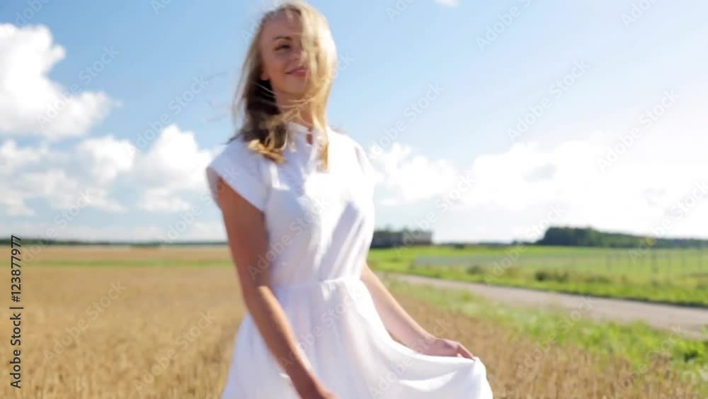 smiling young woman in white dress on cereal field smiling young woman in white dress on cereal field