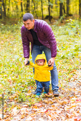 Father and baby son having fun outdoors
