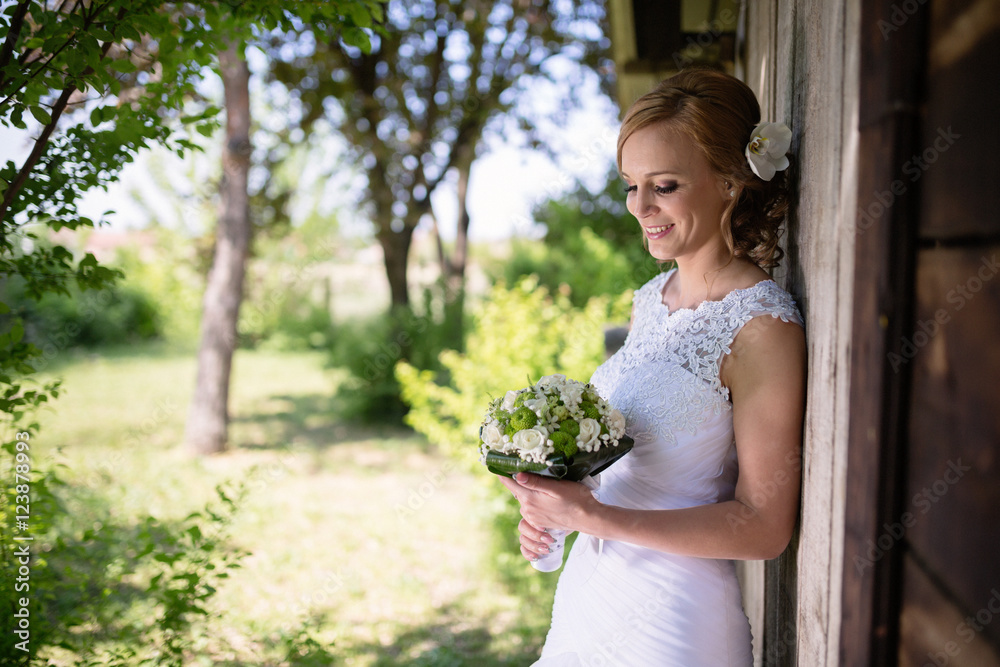 Beautiful bride posing outdoors Beautiful bride posing outdoors