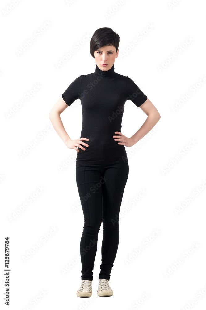Serious bossy short hair pretty woman with hands on hips. Full body length portrait isolated over white studio background. Serious bossy short hair pretty woman with hands on hips. Full body length portrait isolated over white studio background.