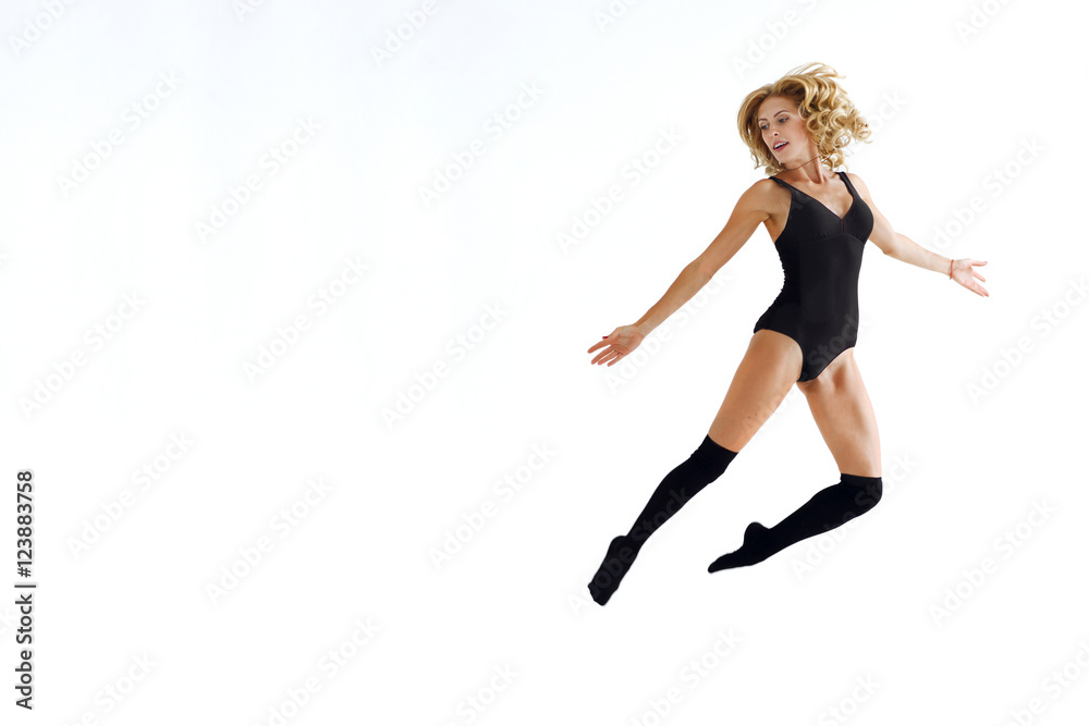Beautiful young dancer posing on white isolated background with copyspace. Don't forget to dance