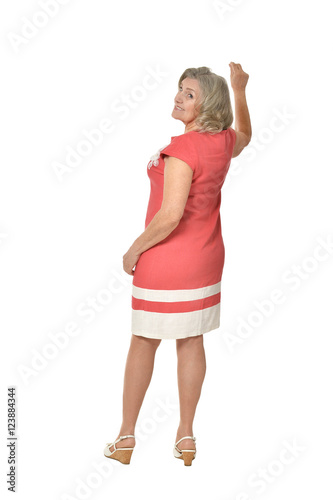 Elderly woman in dress pointing