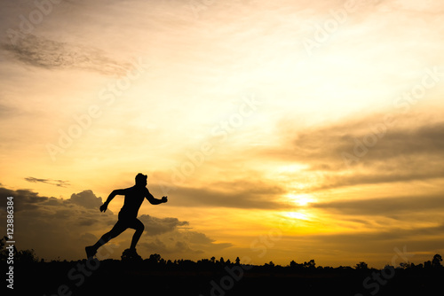 silhouette man jogging on the sunset background