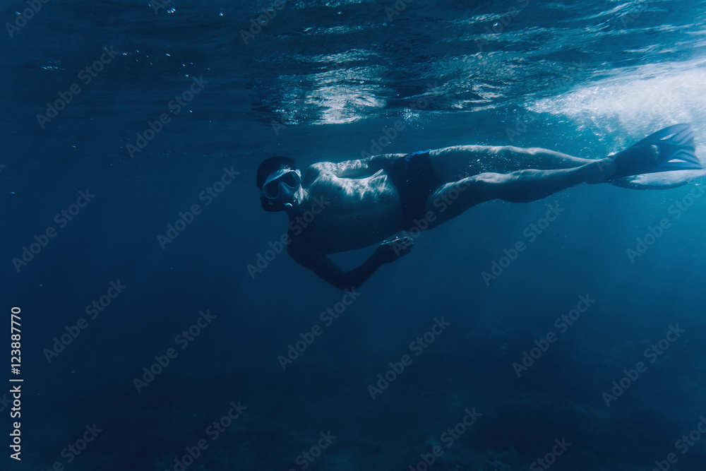 Underwater image of diver man