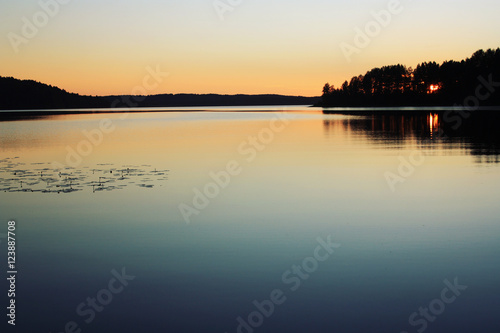 Sunset. Kenozero lake. Aged photo. Russian north.