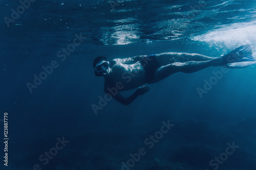 Underwater image of diver man