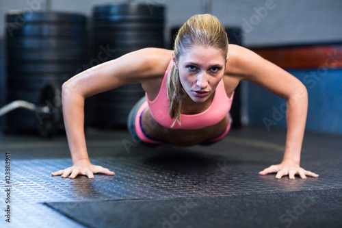 Determined woman doing push-ups 