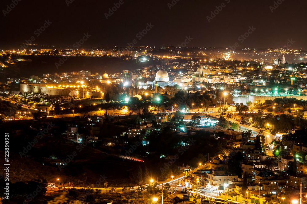 panoramic view of historic town wall and center of jerusalem by night