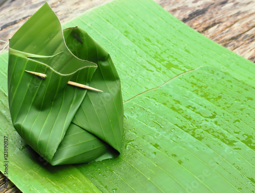 curried fish wrapped in banana leaves photo