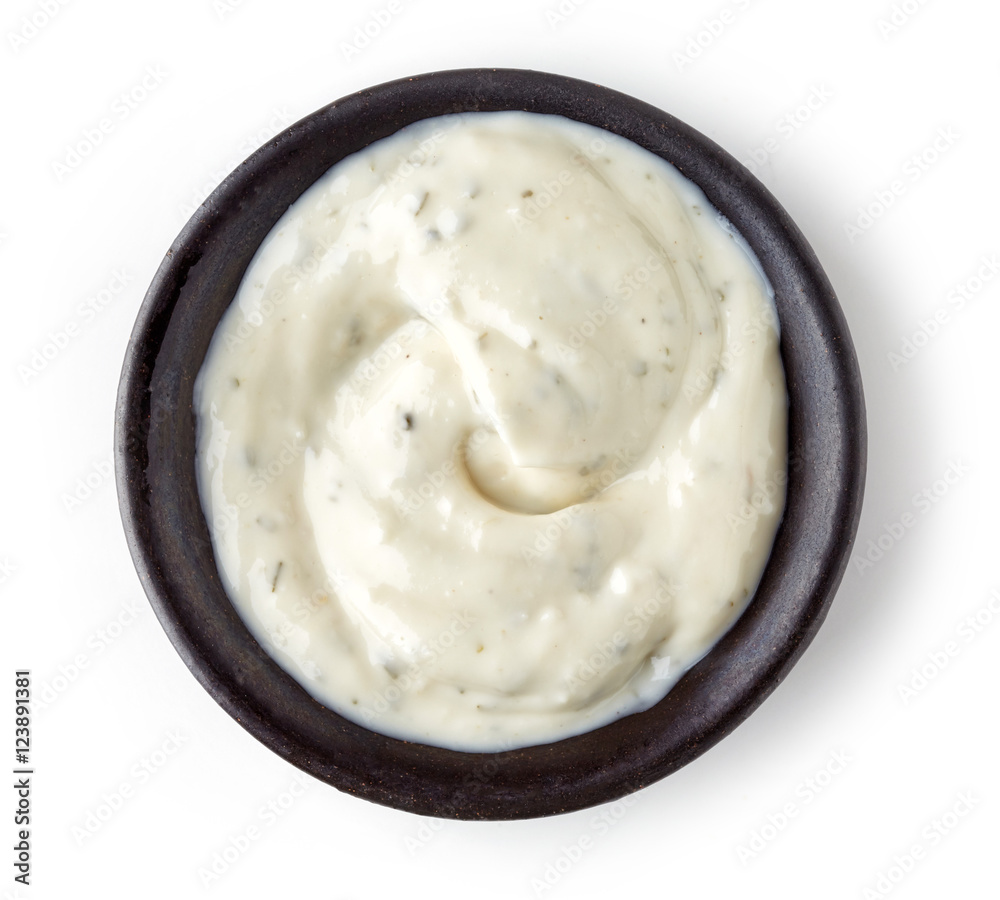 Garlic sauce in round dish on white background Garlic sauce in round dish on white background