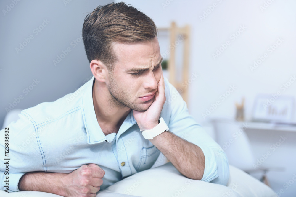 Good looking young man suffering from toothache. Good looking young man suffering from toothache.