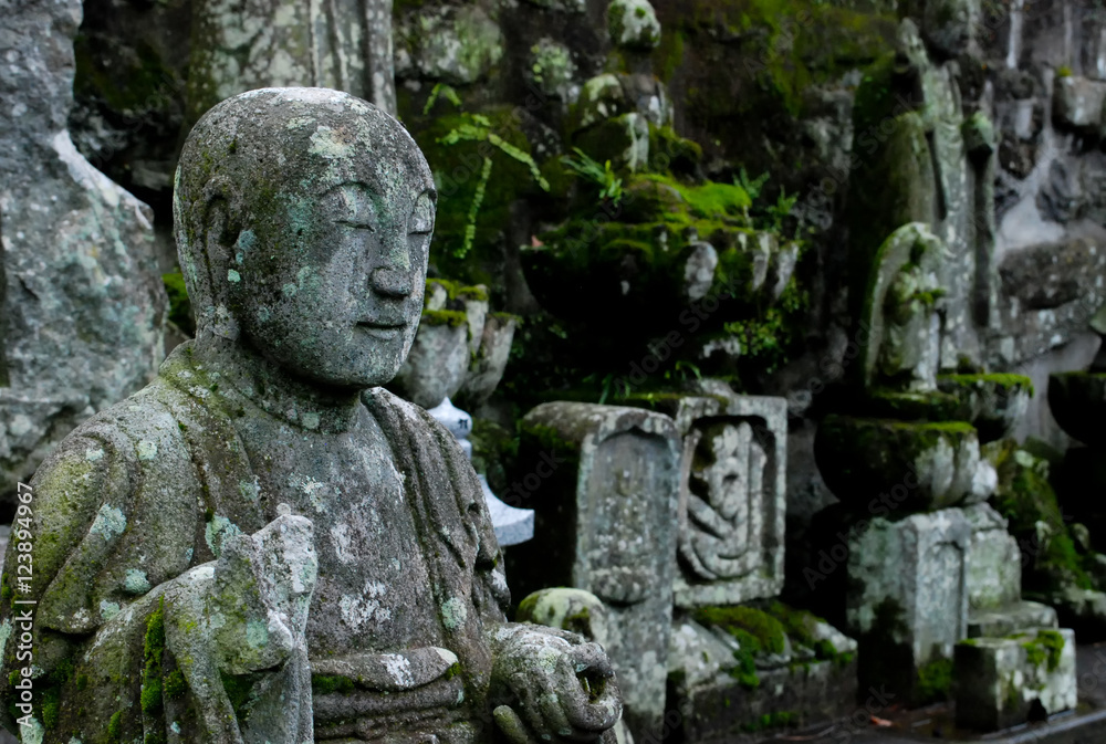 Buddhist stone statue in Japanese cemetery