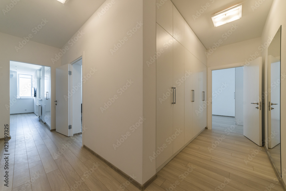 Light interior with flooring in a modern apartment Light interior with flooring in a modern apartment