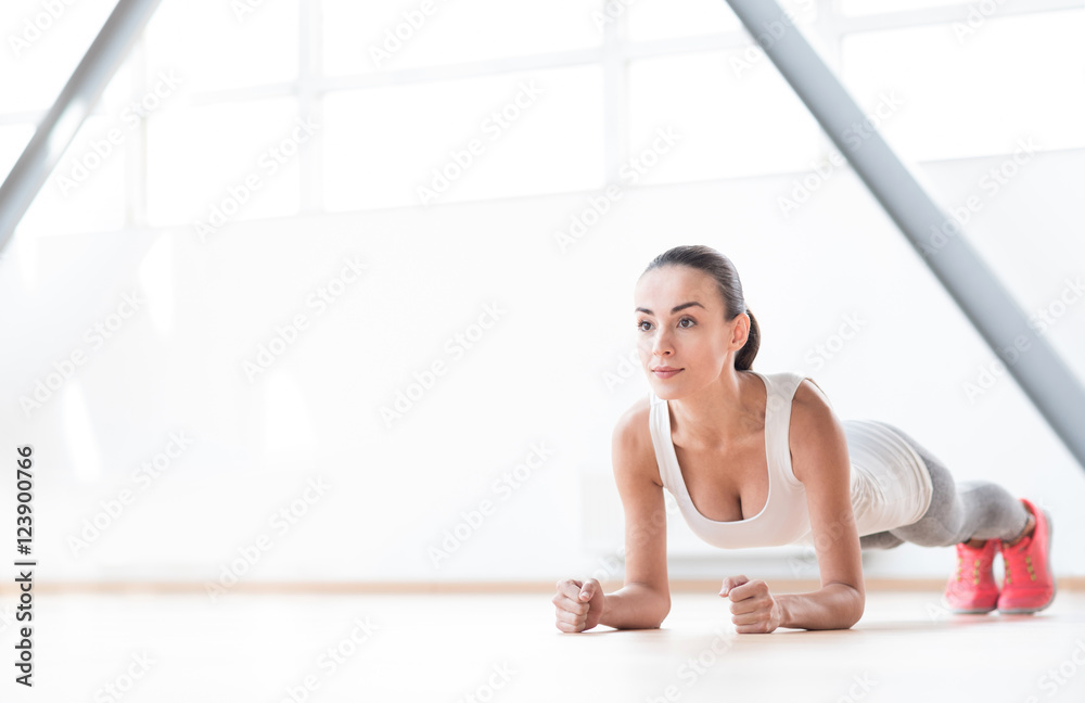 Fototapeta premium Serious well built woman training