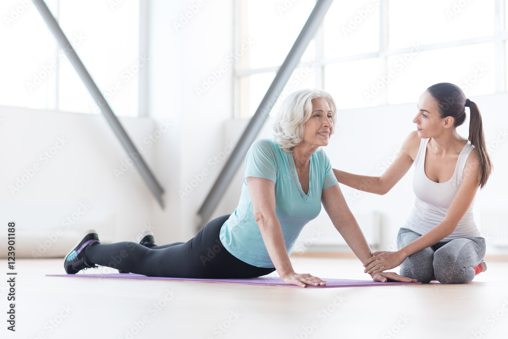 Positive optimistic woman enjoying her physical exercise Positive optimistic woman enjoying her physical exercise