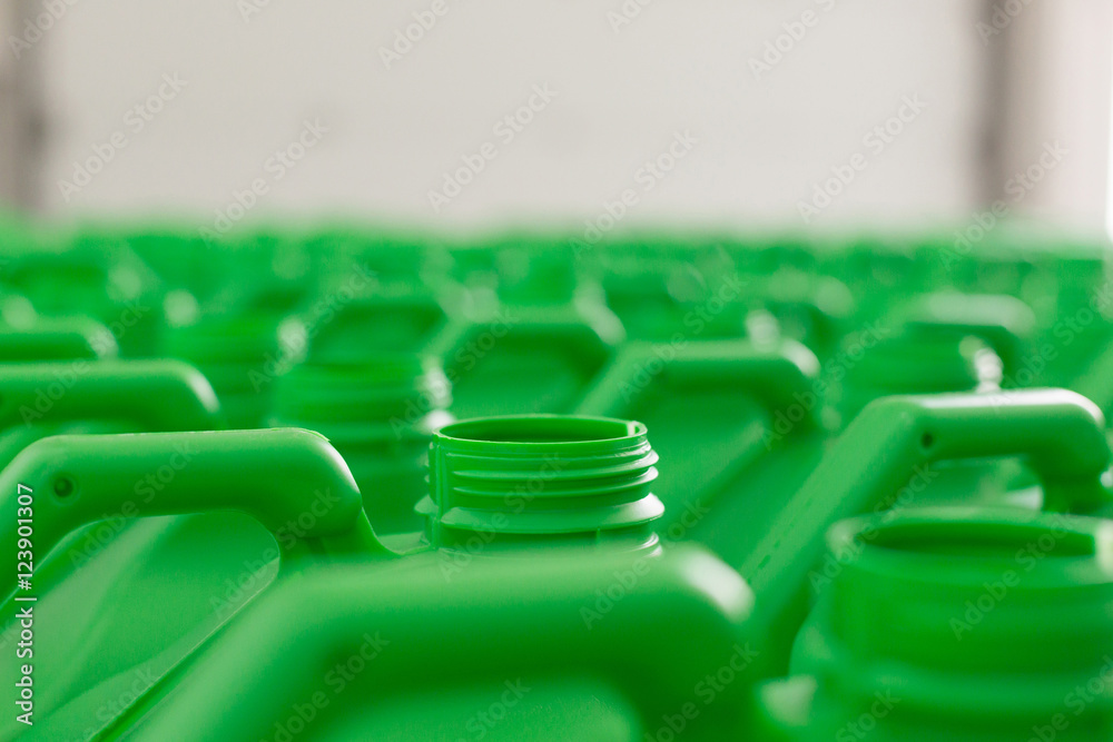 Obraz premium Empty plastic cans green color.