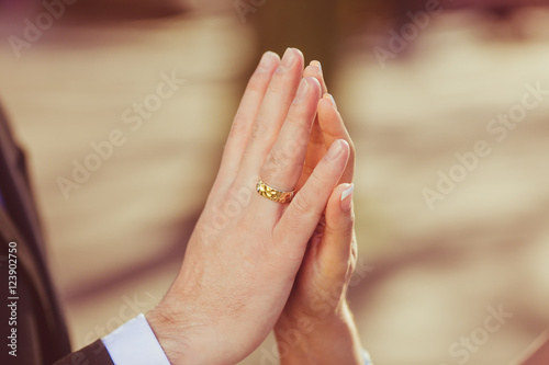 Delicate touch of newlyweds palms