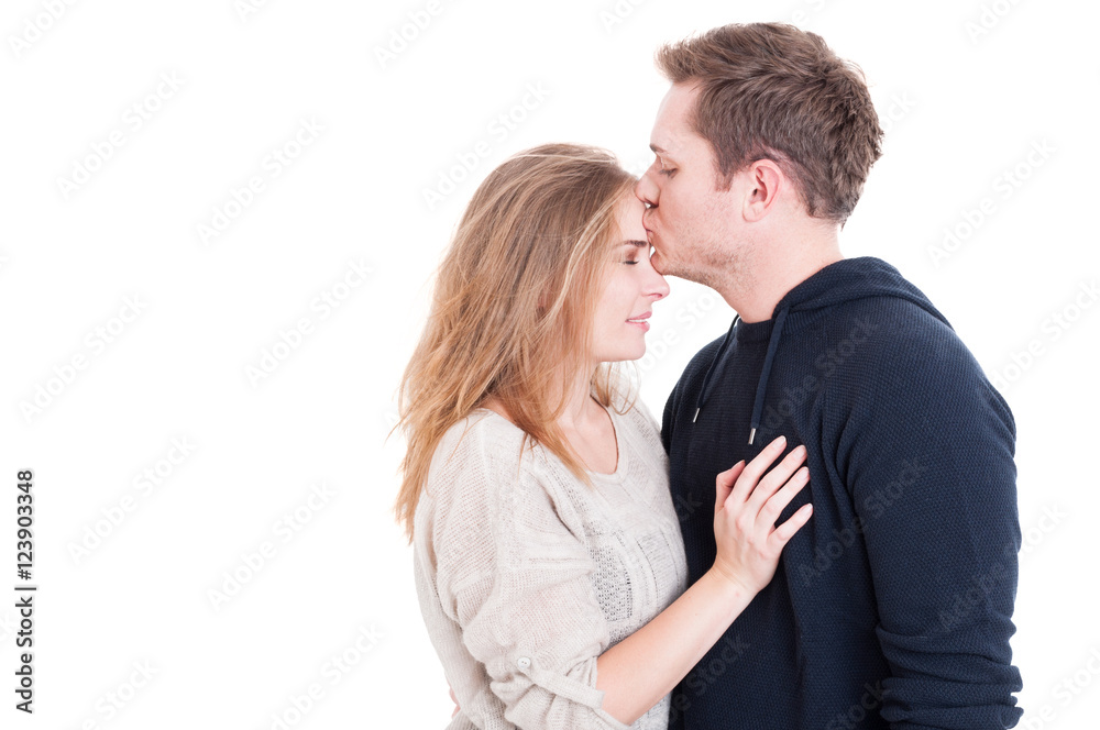 Man kissing on forehead her beautiful lady Man kissing on forehead her beautiful lady