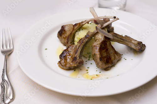 Plated grilled lamb cutlets with polenta