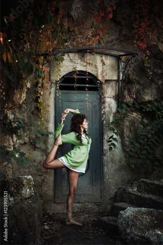woman in yoga balance position outdoor shot