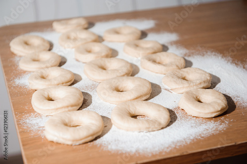 Chef preparing dough - cooking donuts process © nagaets