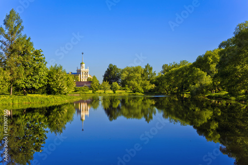 Landscape in Kolpino, overlooking the pond and the building in the style of Stalinist Empire