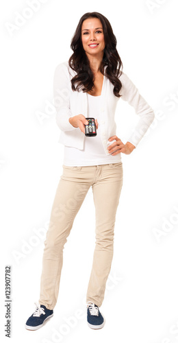 Full-length pretty casual young female woman girl holding using tv electronics remote control isolated on white background