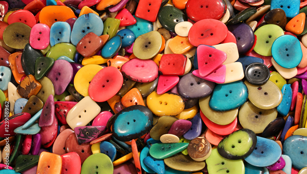 background of colorful buttons made with dried palm seeds background of colorful buttons made with dried palm seeds