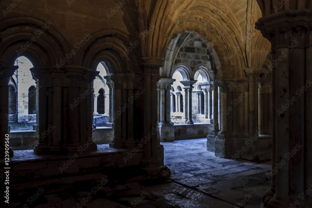 sight of the galleries of the cloister with arches, props and columns of the Romanesque abbey of Santa Maria the Real one in aguilar of Campoo, Palencia, Spain