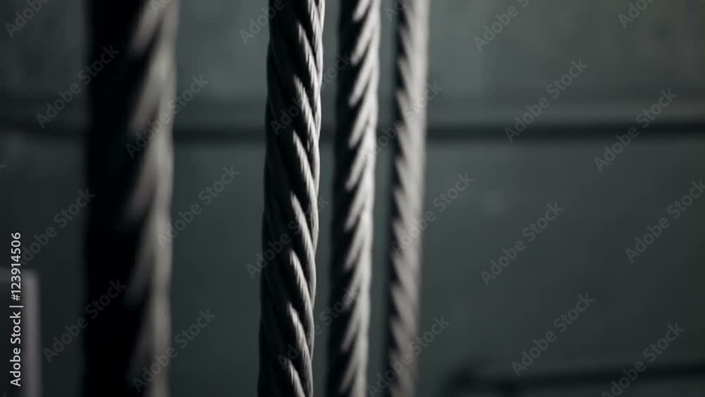 Four elevator hoist metal ropes stopping, mine shaft lifting system ...
