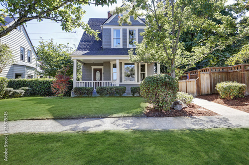 Beautiful curb appeal. American house with well kept front yard. © Iriana Shiyan