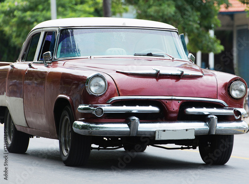 Red American Classic car on street in Havana Cuba