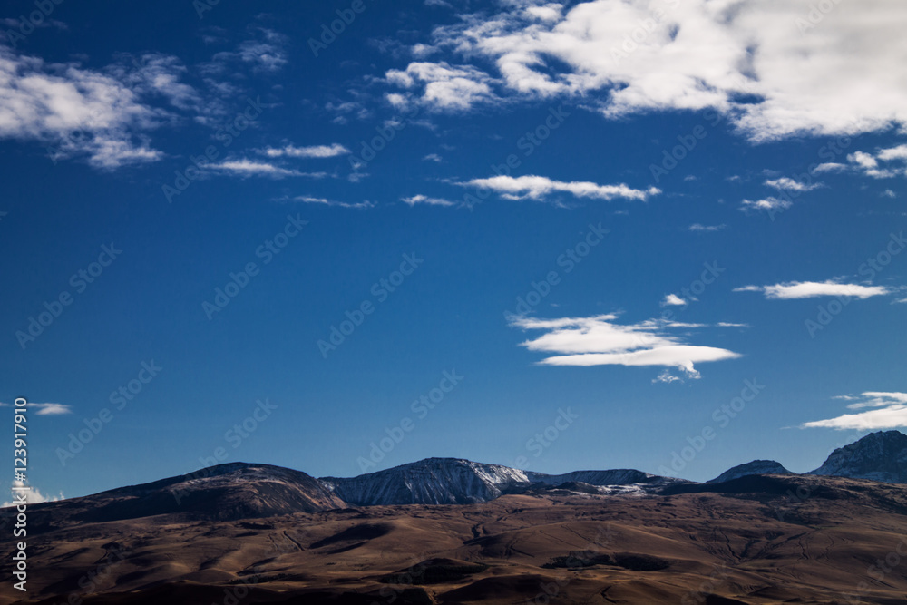 mountain and clouds on the blue sky
